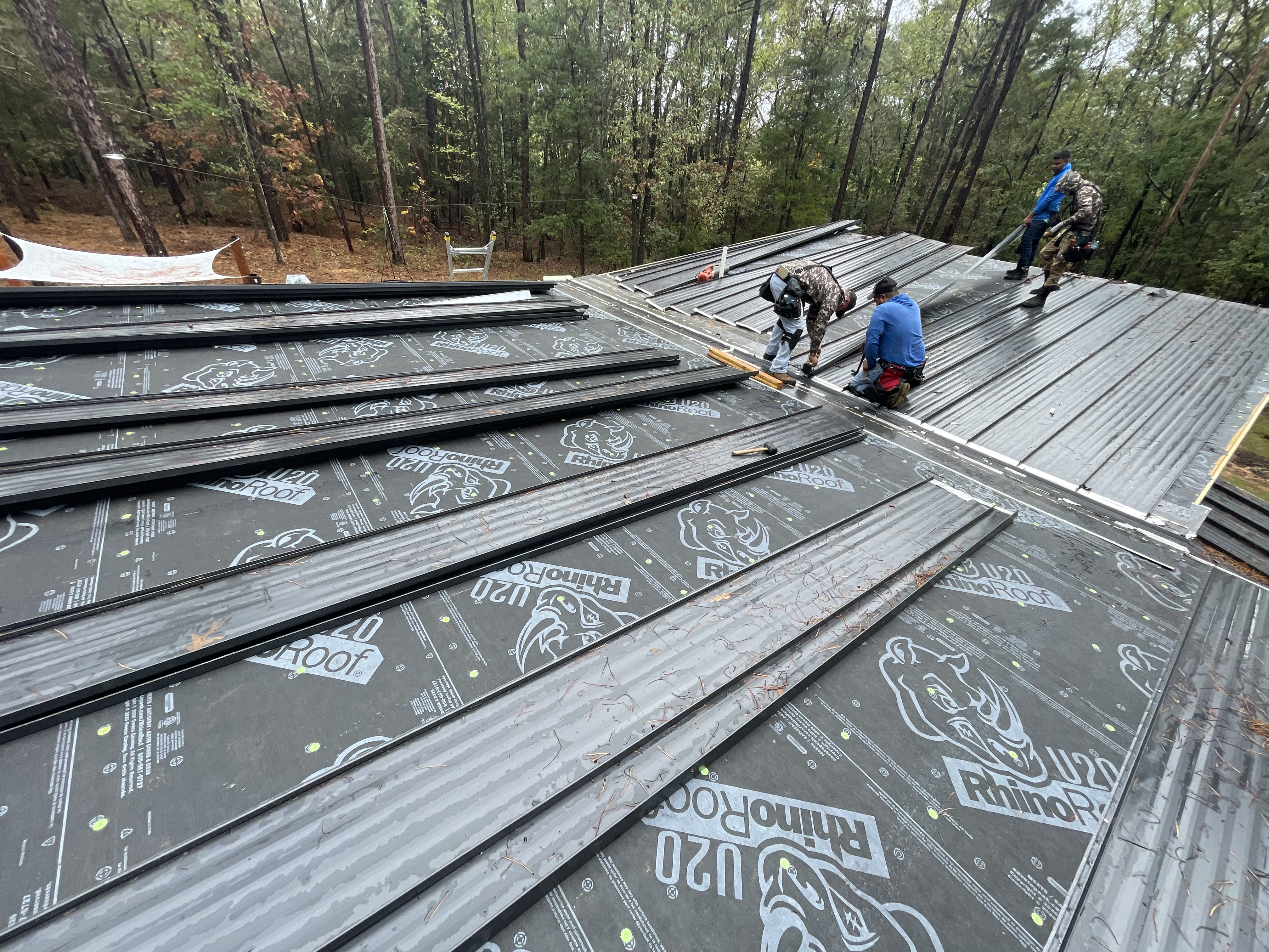 ASAP Roofing crew installing a standing-seam metal roof